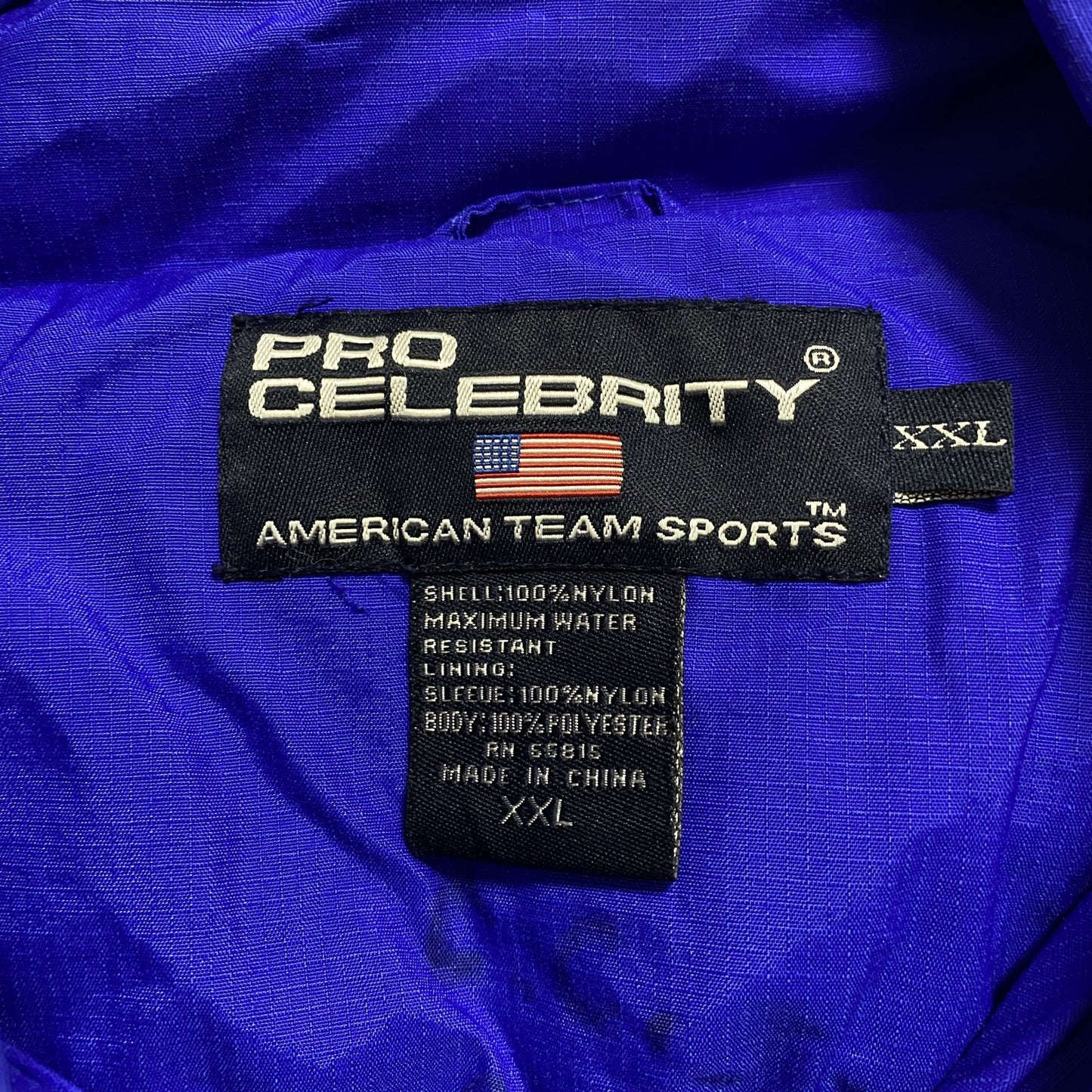 古着 used PRO CELEBRITY 長袖ハーフジップブルゾン ポイント刺繍 FOLSOM フットボール 青 2XLサイズ