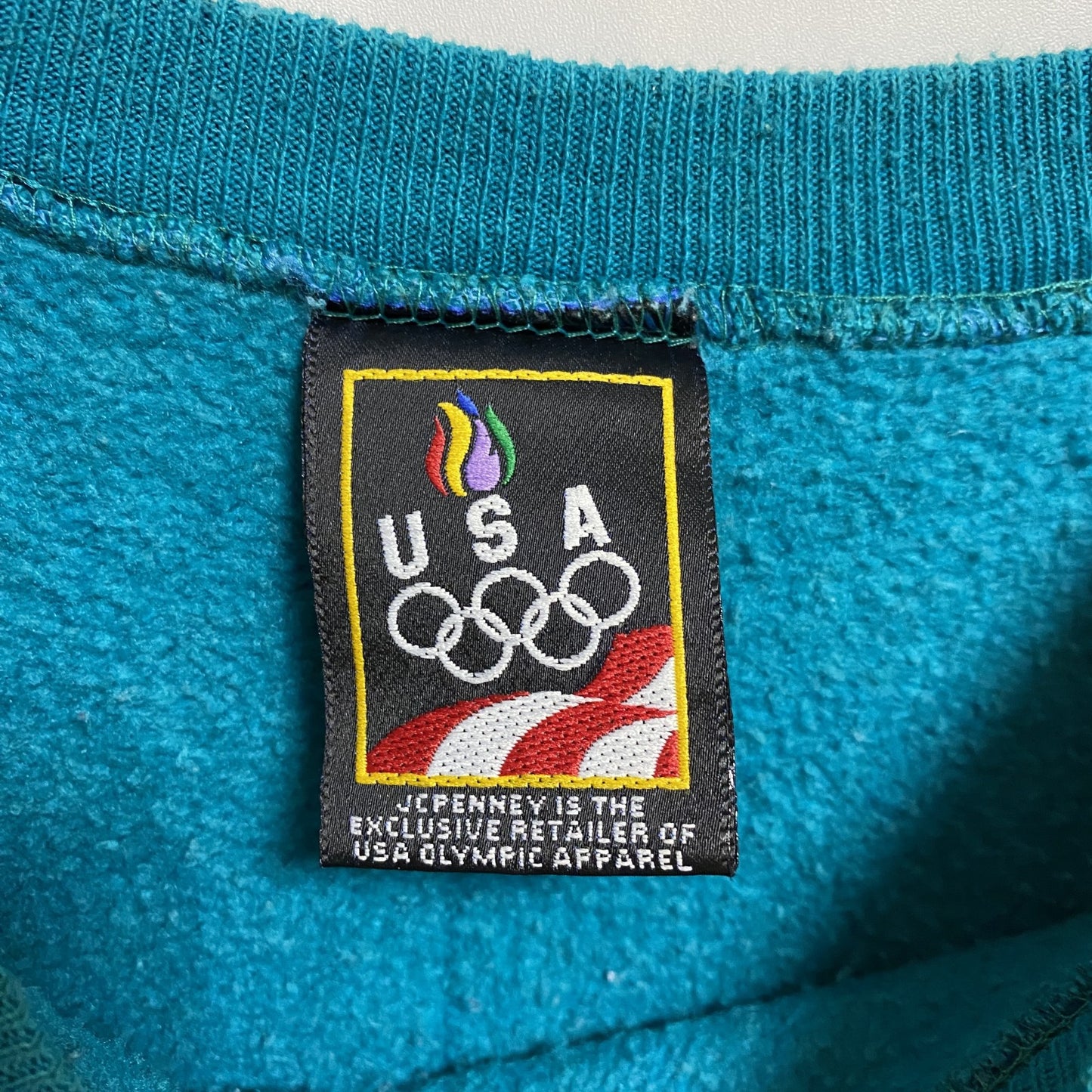 古着 used 90s USA オリンピック JC PENNEY 長袖ワンポイントロゴ刺繍スウェット 青 ターコイズ Lサイズ
