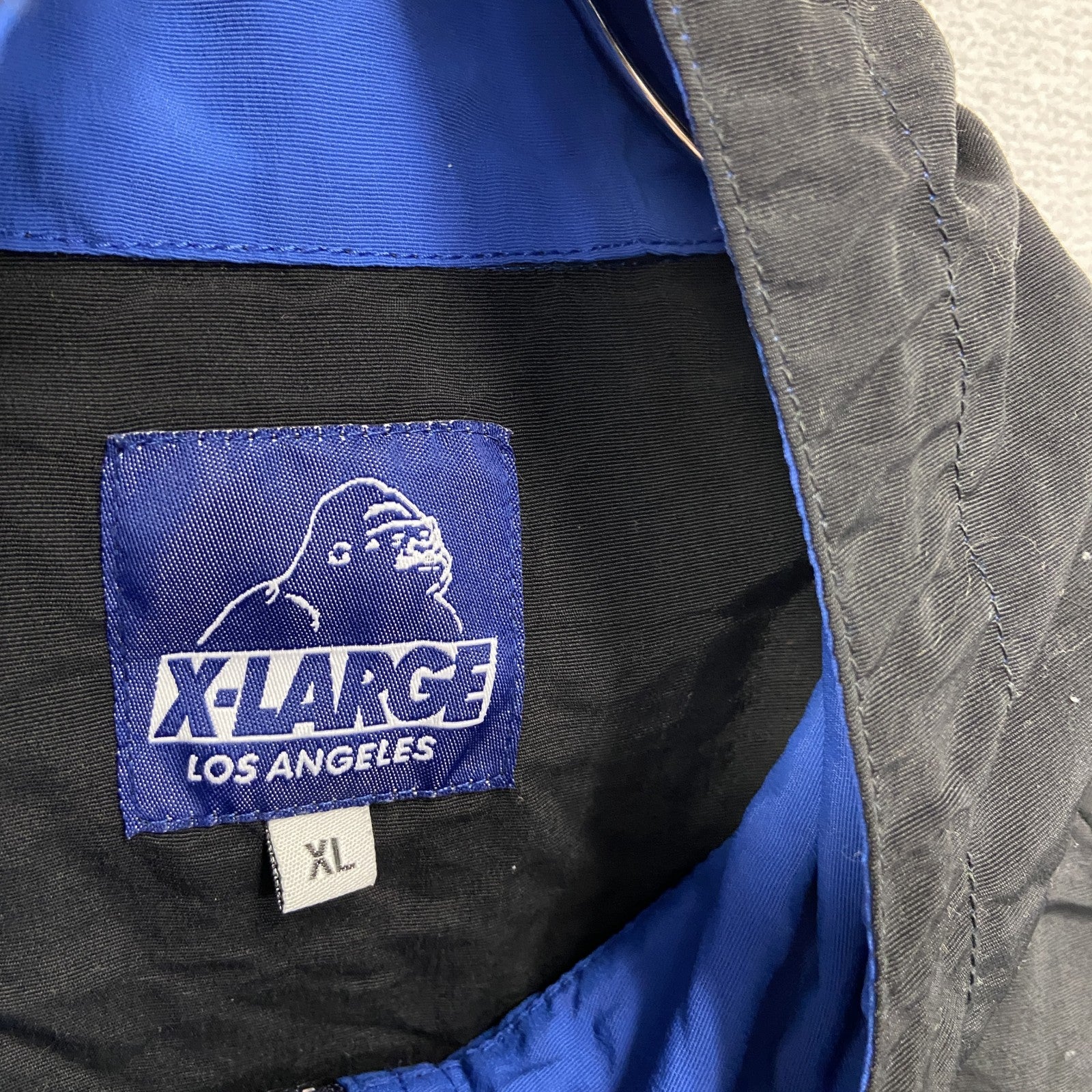X‐LARGE　エクストララージ　フルジップナイロンジャケット/パーカー　比翼仕立て　ワンポイント　青　ブルー　XLサイズ