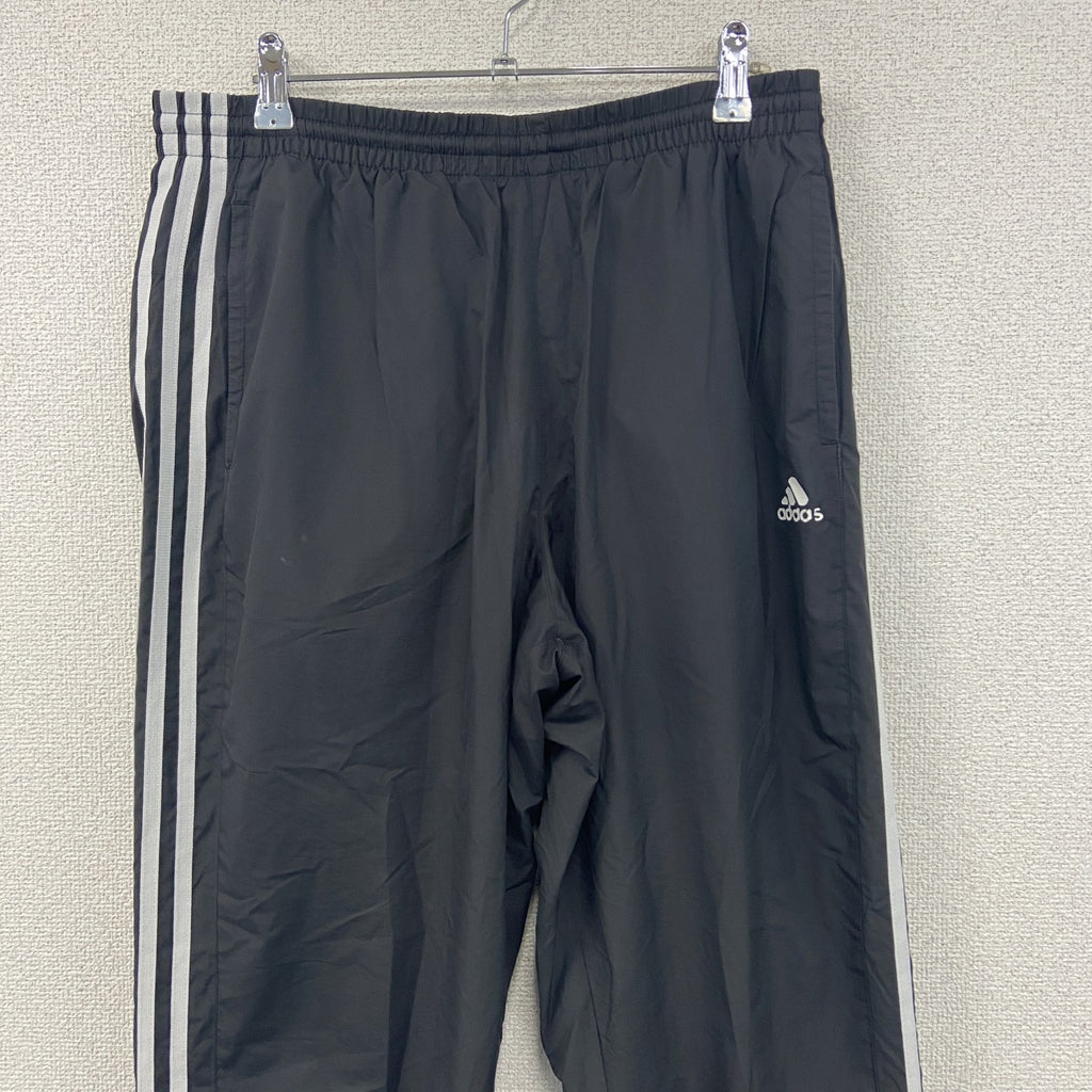 adidas　アディダス　CLIMASTORM　トラックパンツ/ジャージ　パーフォーマンスロゴ　黒　ブラック　Oサイズ