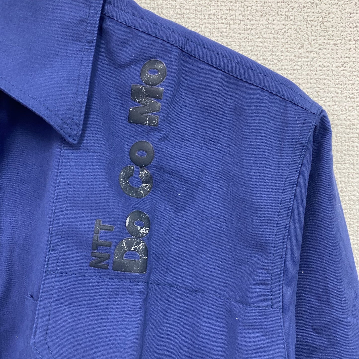 90s　NTT DOCOMO　ドコモ　長袖ワークシャツ　比翼仕立て　デカロゴ　ヴィンテージ　青　ブルー　Mサイズ