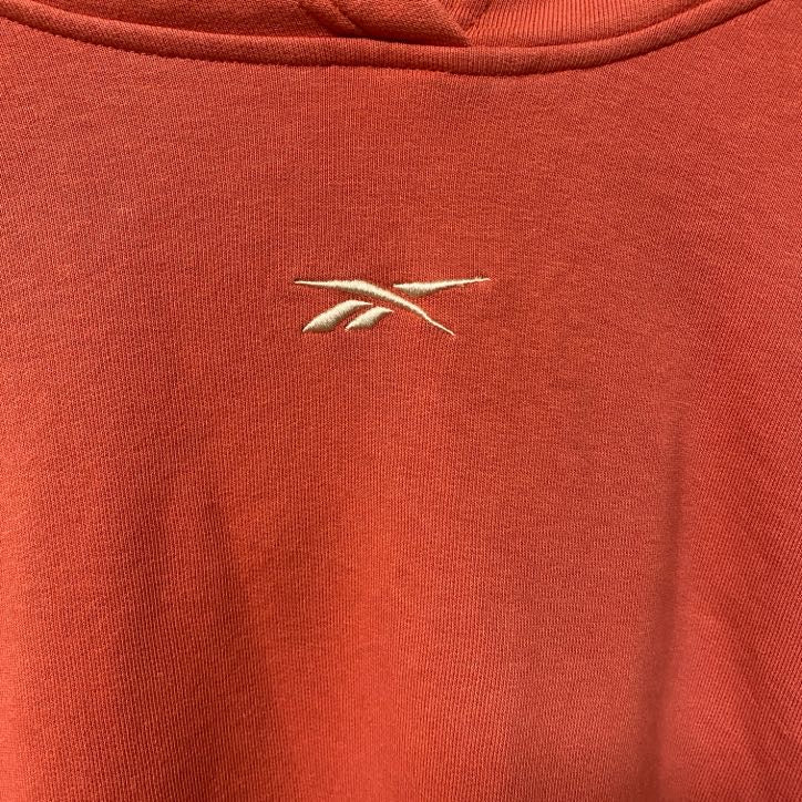 古着 used Reebok リーボック　長袖ワンポイントロゴプルオーバーパーカー　フーディー　バックプリント　オレンジ　Lサイズ