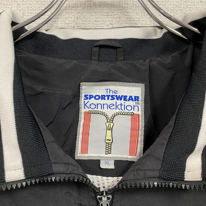 The Sportswear Konnektion　フルジップナイロンジャケット　刺繍ロゴ　アーチプリント　黒　ブラック　XLサイズ