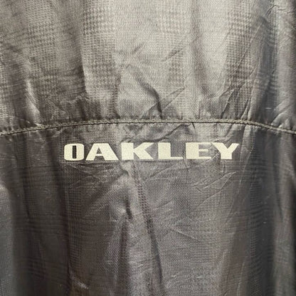 古着 used　OAKLEY　オークリー　長袖薄手ナイロンジャケット　ワンポイント刺繍　地球　pfm　ダークグレー　Lサイズ