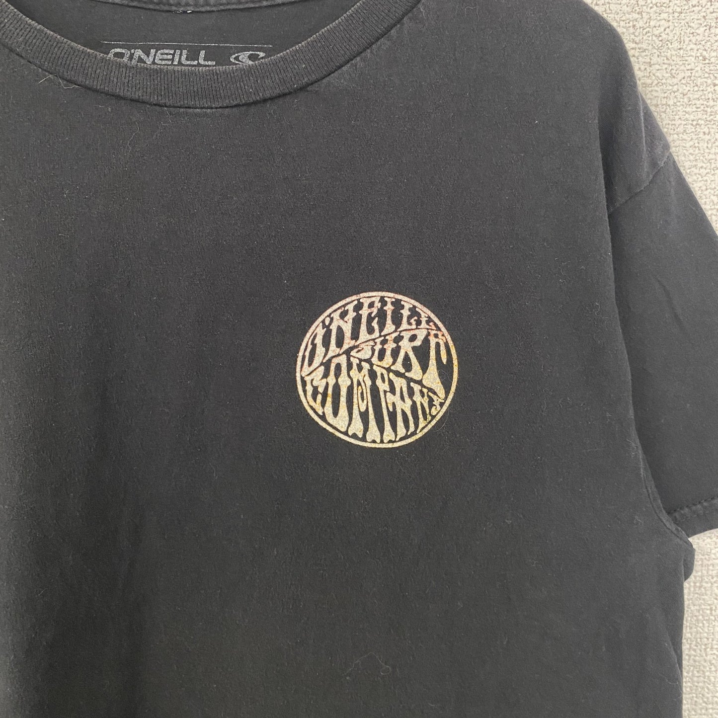 古着 used　O’NEILL　半袖クルーネックデザインTシャツ　バックプリント　黒　ブラック　春夏服　Mサイズ