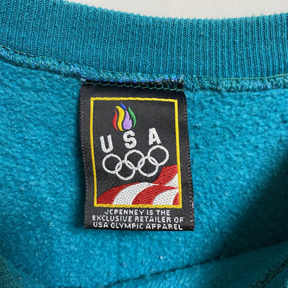 古着 used　90s　USA　オリンピック　JC PENNEY　長袖ワンポイントロゴ刺繍スウェット　青　ターコイズ　Lサイズ