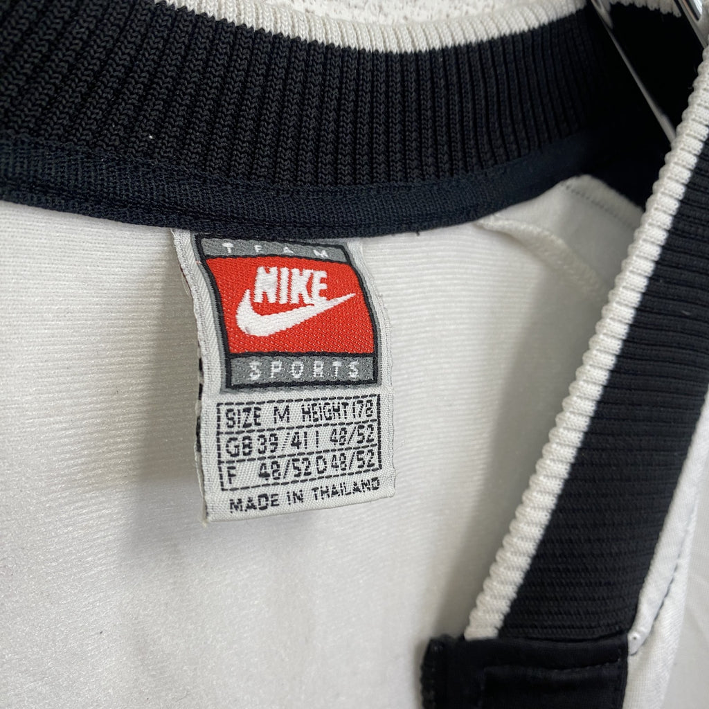 古着 used　90s　NIKE ナイキ　半袖フルジップジャージ　スウッシュロゴ　プリントデザイン　バイカラー　黒　白　Mサイズ