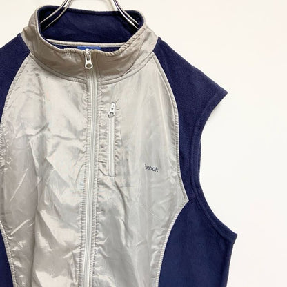 古着 used　Reebok　異素材切替ハイネックベスト　ワンポイントプリント　グレー　ネイビー　ビッグシルエット　2XLサイズ