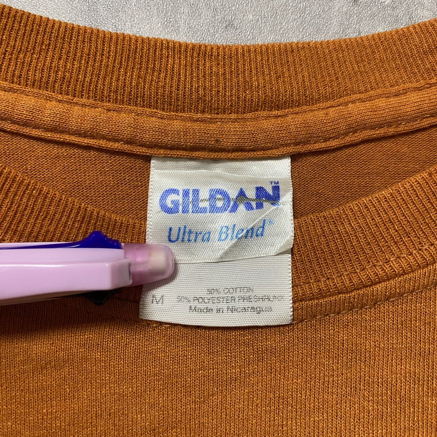古着 used　GILDAN ギルダン　NCAA　テキサス大学　半袖プリントTシャツ　ロングホーンズ　アメフト　オレンジ　Mサイズ